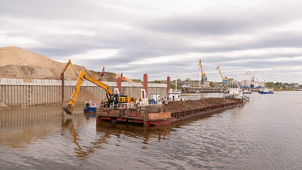 Marine piling construction equipment installing foundation piles along a waterfront project